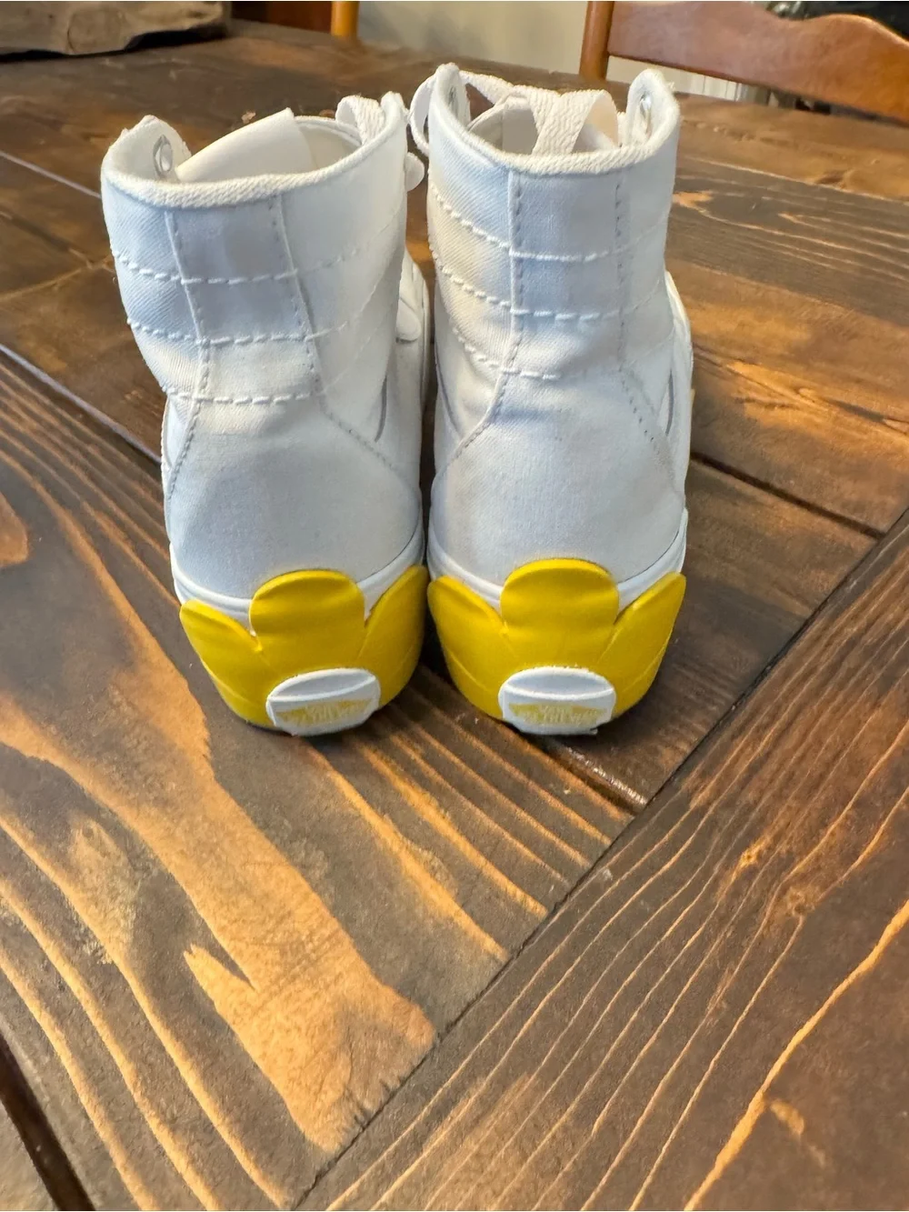 Vans White High-Top Canvas Sneakers with Yellow Logo Accent